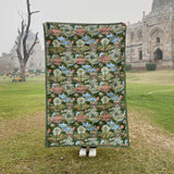 The Lodhi Garden baby quilt hand printed with a green landscape scene inspired by Delhi's famous park.