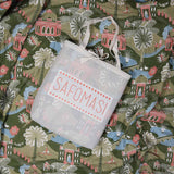 The Lodhi Garden baby quilt in a cotton bag embroidered with the Safomasi logo, ready to gift.