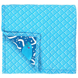 The Blue Ocean Reef Baby Quilt is reversible baby quilt with the blue fish scale print on the back.