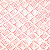 Detail of the hand quilted pink coral reef baby quilt, light pink fish scale pattern on the reverse.