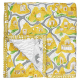 Yellow and Grey Cave House Baby Quilt handprinted with a landscape print inspired by Cappadocia, Turkey onto soft cotton.