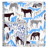 Horse Ranch baby quilt handprinted with a blue, grey and brown pattern of horses in a ranch.