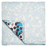 The reverse of the Rockpool baby quilt handprinted with a light blue limpet shell print
