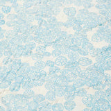 Close up of the light blue Limpet print on the back of the Rockpool baby quilt.
