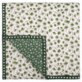 Green pine baby quilt handprinted with a nature inspired pattern of pine tree branches.
