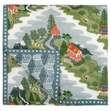Mountain Zig Zag baby quilt handprinted with an alpine scene inspired by the Himalayas, featuring snow capped peaks, tea estates, apple trees, pine trees, goats and holidaymakers.