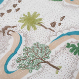 Close up of the hand printed hand quilted Winding Roads baby quilt with illustrations of palm trees, cacti, winding rivers and roads.