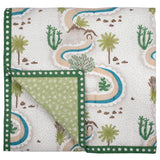Winding Roads Baby Quilt handprinted with a nature inspired landscape of winding roads, rivers, palm trees, and cacti in hues of green, blue, and taupe.
